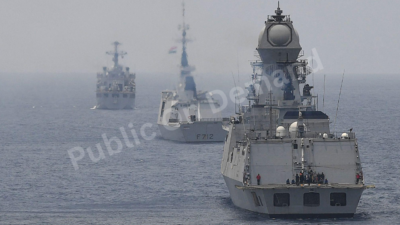 Multinational naval exercise ships in formation