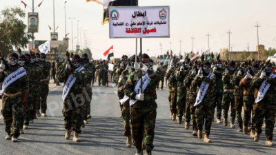 Popular Mobilization Forces PMF militia fighters Iraq