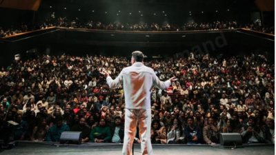 Zakir Khan performing live stand-up comedy on stage